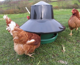 King Outdoor Feeder 25kg. Complete with 'top hat' design to keep away the rain from the feed. Robust standing feeder in green/black. Holds full 25kg sack of poultry feed. 